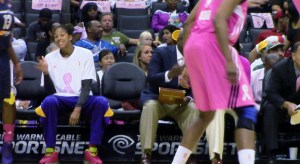Sparks star Candace Parker, sidelined with a strained left knee,  grimaces during L.A.'s 77-73 win over Indiana Monday night at Staples Center.