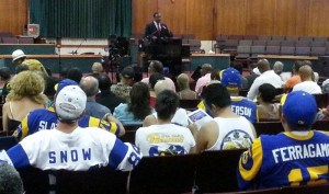 Members of Bring Back the L.A. Rams listen to Inglewood Mayor James T. Butts discussing bringing the NFL to Hollywood Park. St. Louis Rams owner Stan Kroenke owns 60 acres of Inglewood land.
